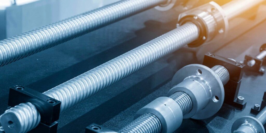 Radonix: High-precision CNC ball screw system showing helical grooves and nut assembly for backlash-free motion.