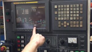 CNC Operator Responsibilities: What Every Operator Must Know 1 CNC operator responsibilities shown on FANUC CNC control panel with axis positions, offsets & operator selecting machine mode