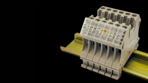 Wire tag markers on DIN rail terminal blocks for clear wire identification in industrial control panels
