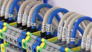 Wire tag cable labeling on electrical panel terminals for industrial wire identification